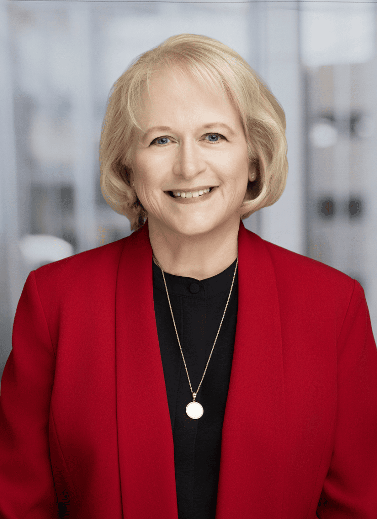 Ellen Wood, professional business leader at VCFO in a corporate setting.