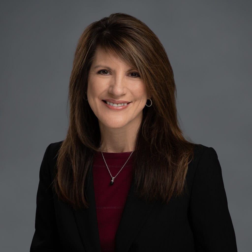 Shelley Sedillo smiling in professional attire at vcfo headquarters.