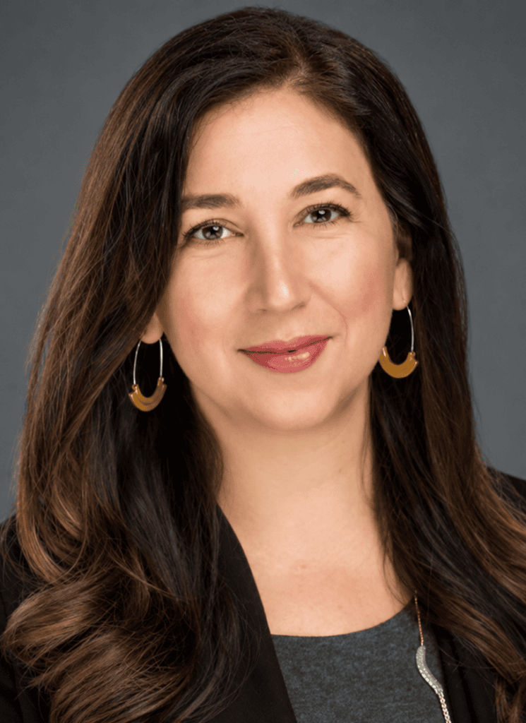 Christine Roach smiling, professional portrait for vcfo, showcasing leadership and expertise.