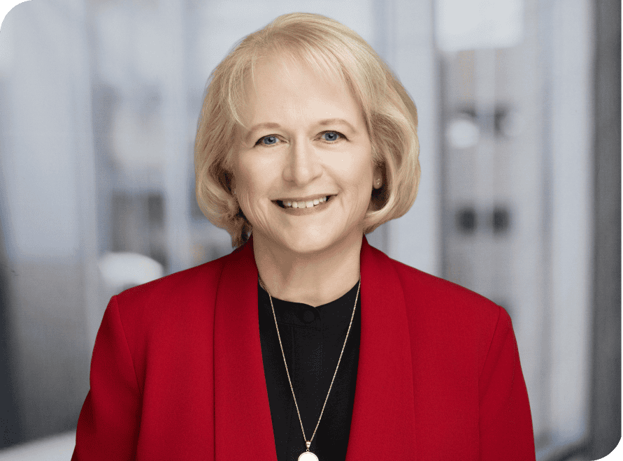 Ellen Wood smiling in professional attire at VCFO, a leading financial consulting firm.