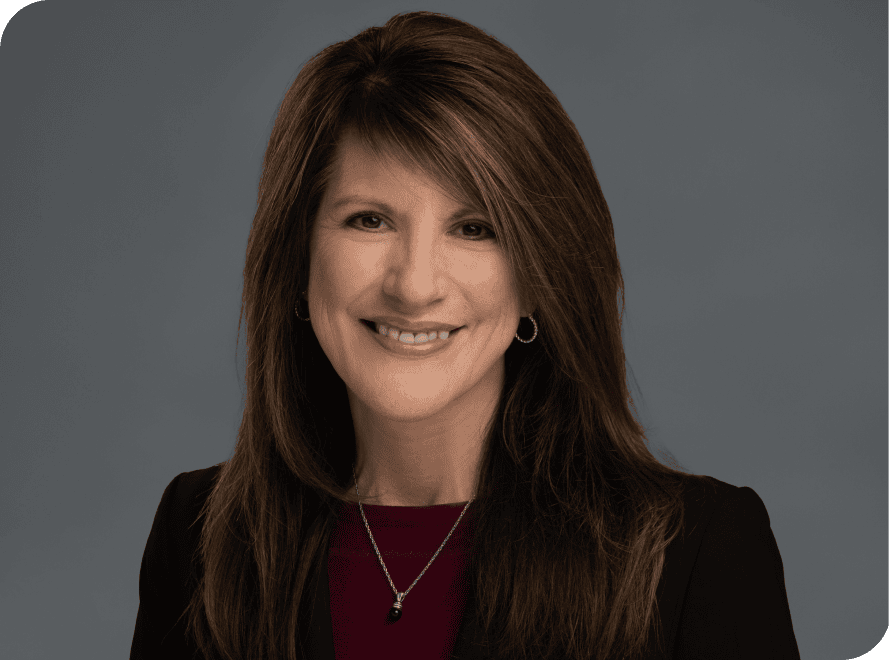 Professional portrait of Shelley Sedillo, a financial expert at VCFO, showcasing leadership and expe.