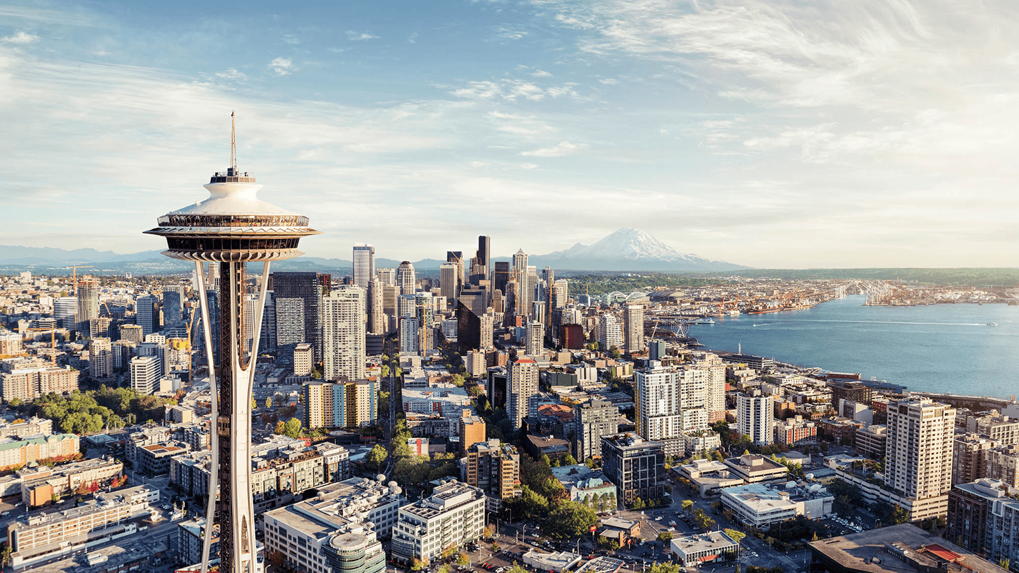 Seattle cityscape featuring the Space Needle and downtown skyline.