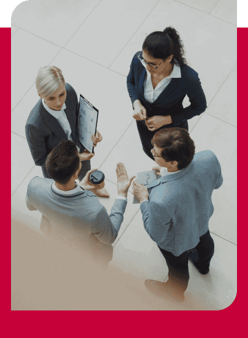 Business professionals discussing data and strategies in a modern office.
