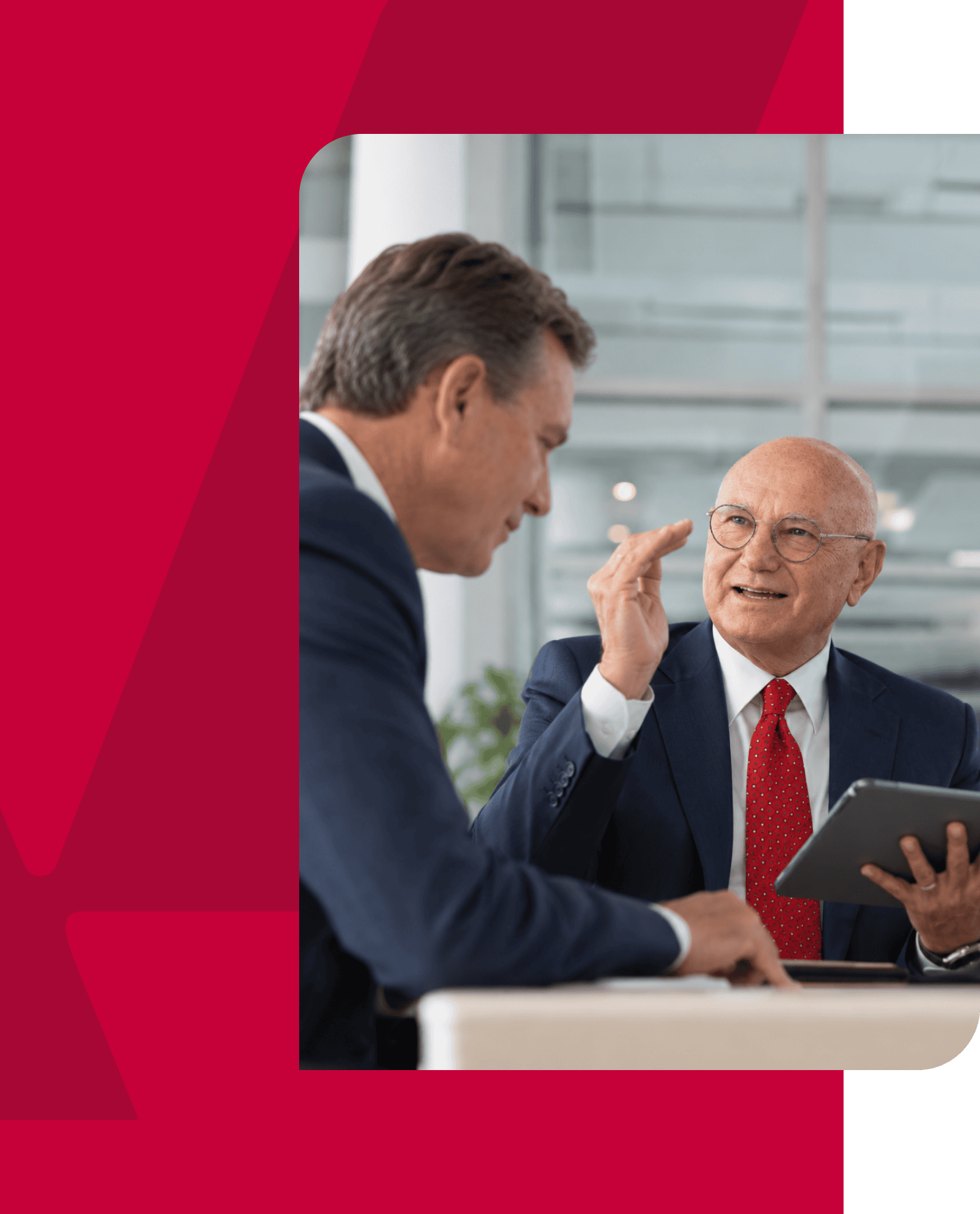 Business professionals discussing strategy in a modern office setting.