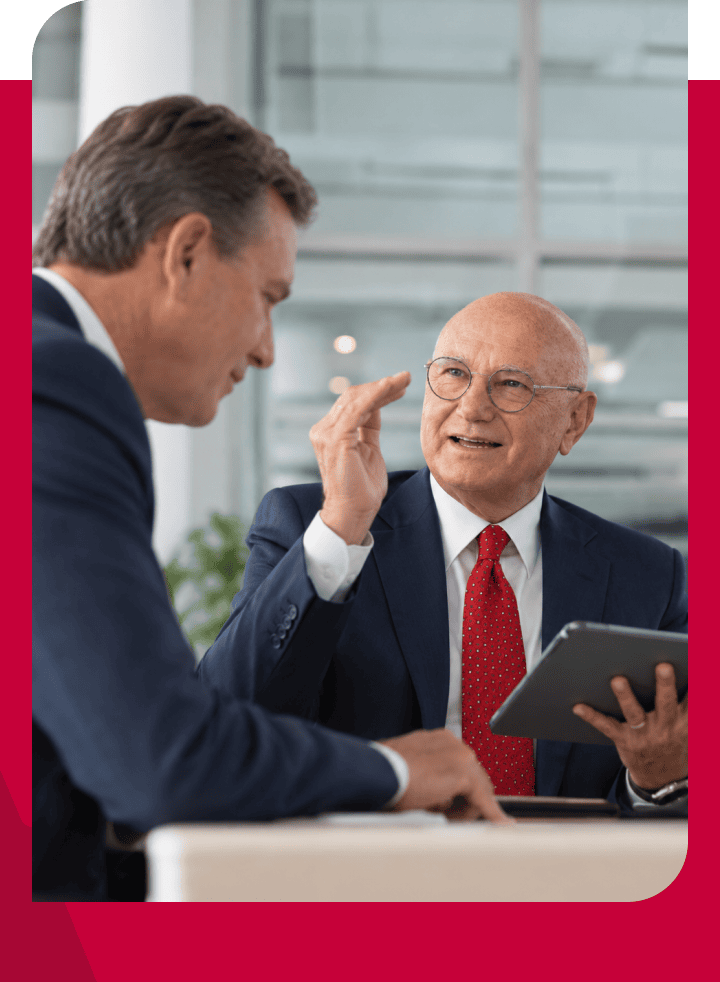 Businessmen discussing in a modern office during a meeting.