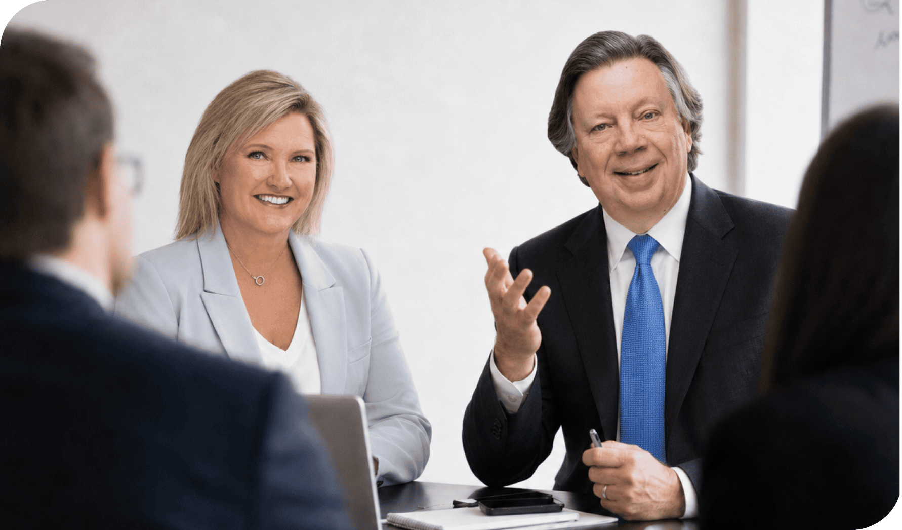 Business professionals in a meeting discussing finance and accounting strategies.