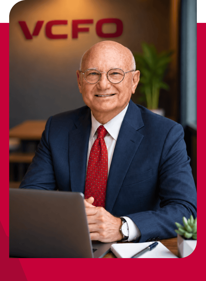 Professional senior businessman in a suit at VCFO office.