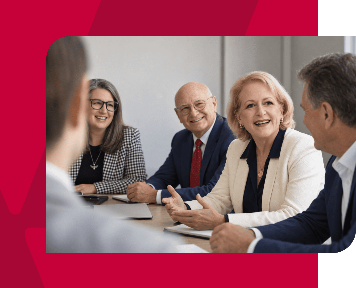 Business meeting with diverse professionals discussing strategy in a conference room.