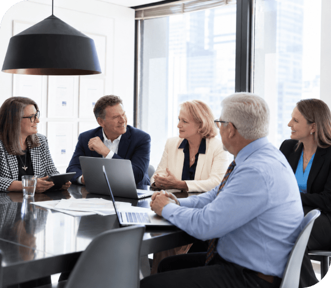 Business team in a meeting discussing strategies at a modern office.