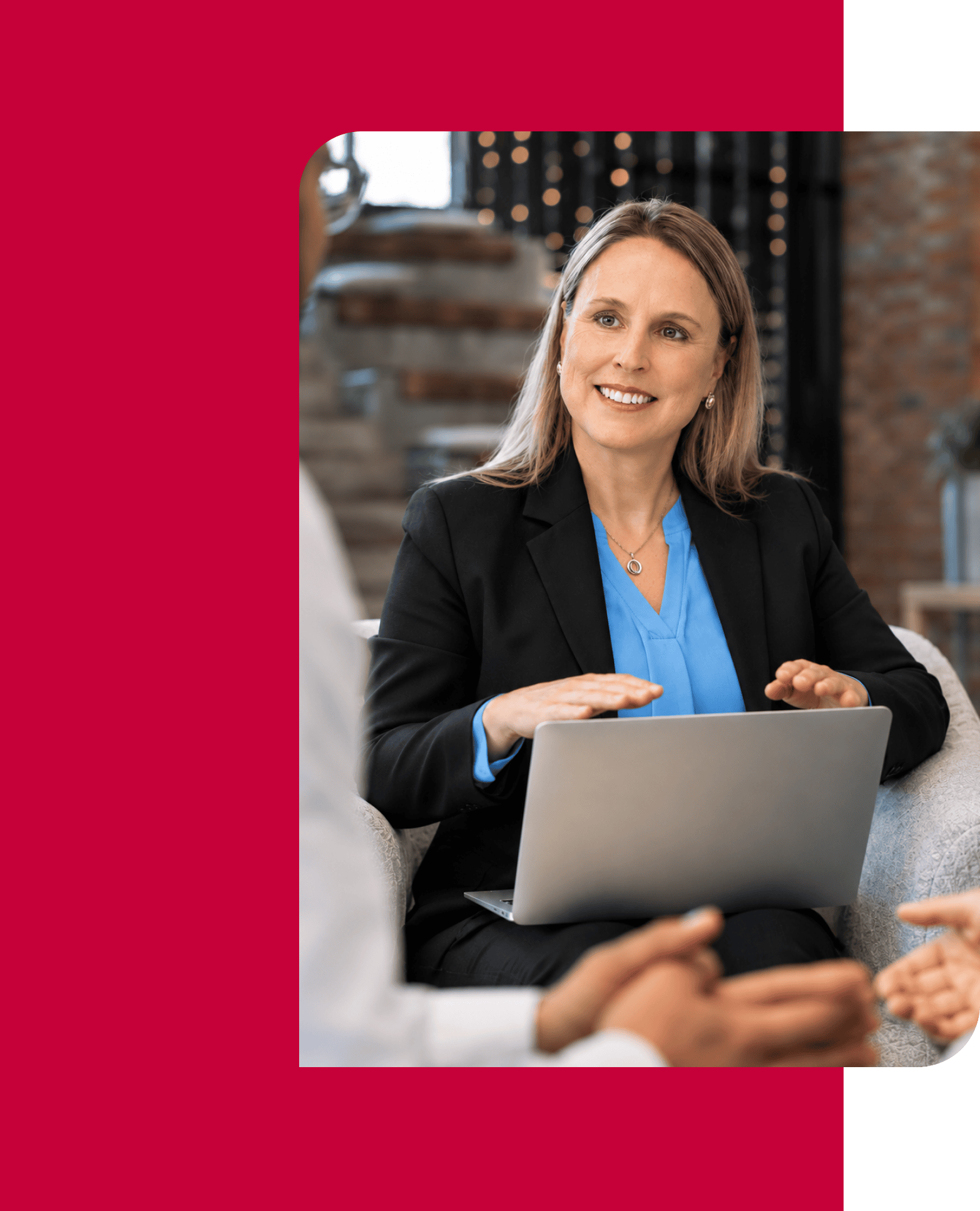 Businesswoman discussing financial insights during a meeting with a laptop.