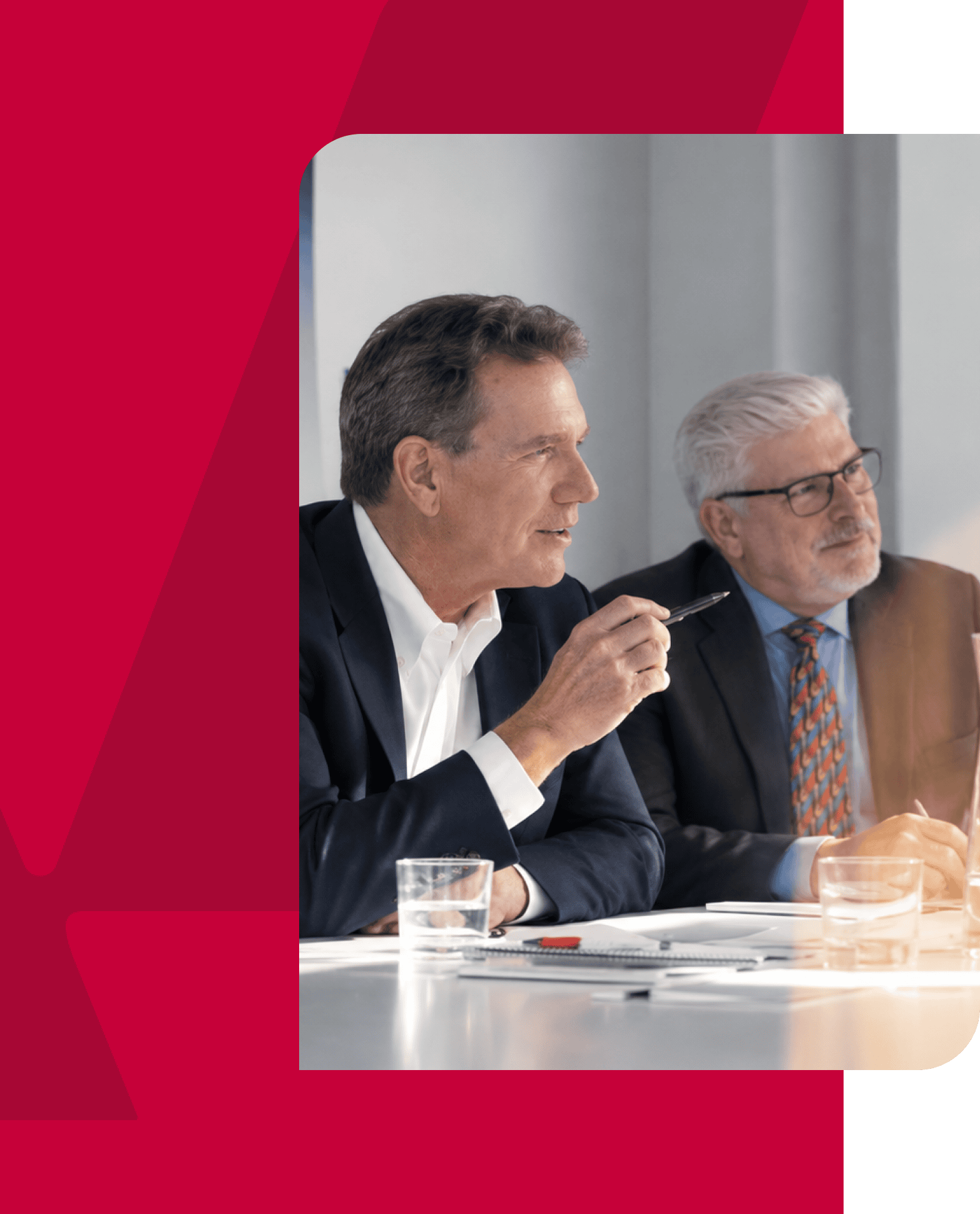 Business professionals discussing during a meeting at a conference table.
