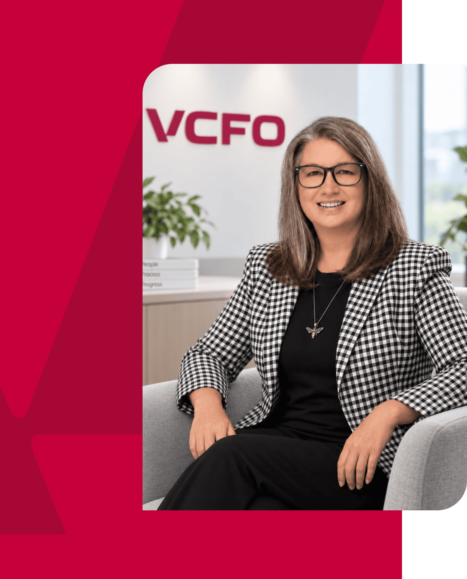 Professional woman smiling in office with VCFO logo in background.