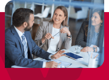 Business professionals in a meeting discussing strategies at a modern office.