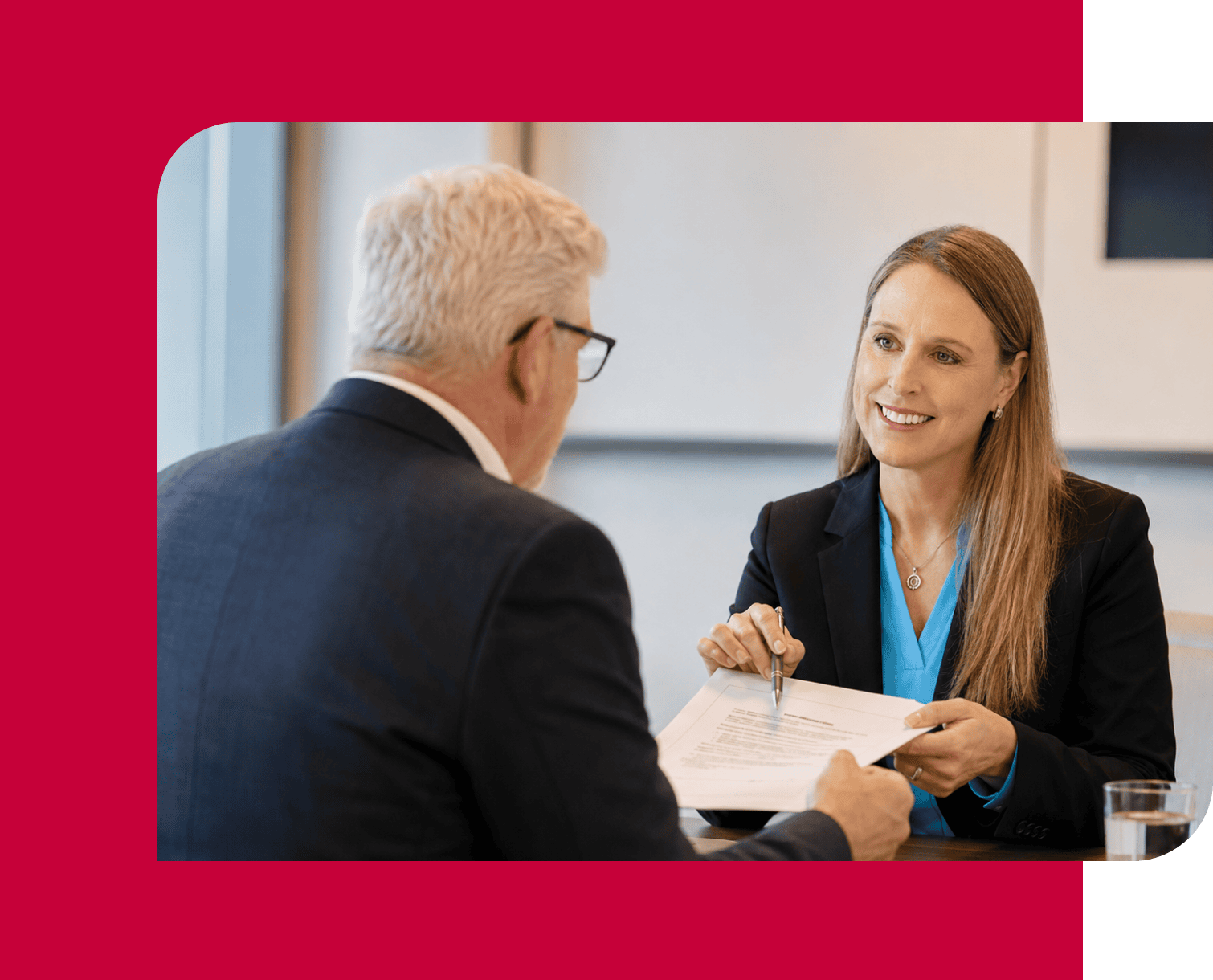 Business meeting between a woman and a man discussing work plans.